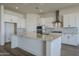 Spacious kitchen featuring white cabinets and granite countertops at 18956 W Ocotillo Rd, Waddell, AZ 85355