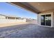 Covered patio overlooks a large, fenced backyard at 19020 W Ocotillo Rd, Waddell, AZ 85355