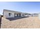 Empty lot with new home in background at 19020 W Ocotillo Rd, Waddell, AZ 85355
