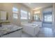 Bathroom with granite countertop, bathtub, and walk-in shower at 19020 W Ocotillo Rd, Waddell, AZ 85355
