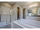 Bathroom with soaking tub and walk-in shower at 19020 W Ocotillo Rd, Waddell, AZ 85355