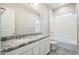 Bathroom boasts double vanity with granite countertop and a bathtub at 19020 W Ocotillo Rd, Waddell, AZ 85355