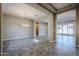 Bright dining room with tile floors and modern chandelier at 19020 W Ocotillo Rd, Waddell, AZ 85355