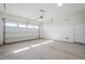 Spacious garage with automatic door opener and extra storage at 19020 W Ocotillo Rd, Waddell, AZ 85355