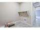 Laundry room with shelving and space for washer and dryer at 19020 W Ocotillo Rd, Waddell, AZ 85355