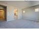 Main bedroom with carpet and ensuite bathroom at 19020 W Ocotillo Rd, Waddell, AZ 85355