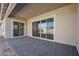 Covered patio with sliding glass doors leading to backyard at 19020 W Ocotillo Rd, Waddell, AZ 85355