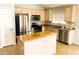 Well-equipped kitchen with stainless steel appliances and a functional center island at 745 E Megan St, Chandler, AZ 85225