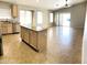 Open-concept kitchen with an island, stainless steel appliances, and tile flooring at 745 E Megan St, Chandler, AZ 85225