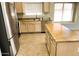 Bright kitchen with granite countertops, stainless steel appliances, and center island at 745 E Megan St, Chandler, AZ 85225