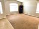 Bright and airy living room featuring neutral carpet, vaulted ceiling, and large windows at 745 E Megan St, Chandler, AZ 85225