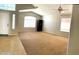 Spacious living room with high ceilings, neutral carpet, and ample natural light at 745 E Megan St, Chandler, AZ 85225