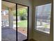 View of backyard through sliding glass doors at 11631 N 112Th St, Scottsdale, AZ 85259