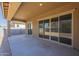 Covered patio with sliding glass doors leading to backyard at 260 S 165Th Ave, Goodyear, AZ 85338