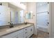 Modern bathroom with double vanity, a bathtub, and shower at 260 S 165Th Ave, Goodyear, AZ 85338