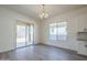 Light-filled dining area with sliding glass doors and chandelier at 260 S 165Th Ave, Goodyear, AZ 85338