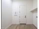 Laundry room with built-in shelving and a door at 260 S 165Th Ave, Goodyear, AZ 85338