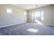 Spacious bedroom with plush carpeting and large window at 6722 N 190Th Dr, Waddell, AZ 85355