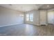 Spacious dining area with wood-look floors and lots of natural light at 6722 N 190Th Dr, Waddell, AZ 85355