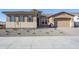 New construction home with a two-car garage and desert landscaping at 6722 N 190Th Dr, Waddell, AZ 85355