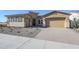 New construction home with a two-car garage and desert landscaping at 6722 N 190Th Dr, Waddell, AZ 85355