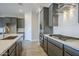 Modern kitchen with gray cabinets, white subway tile, and gas range at 6722 N 190Th Dr, Waddell, AZ 85355