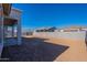 Large backyard with block wall and desert landscaping at 19014 W Ocotillo Rd, Waddell, AZ 85355