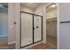 Modern bathroom with a glass shower and access to closet at 19014 W Ocotillo Rd, Waddell, AZ 85355