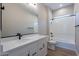 Modern bathroom featuring a white vanity and bathtub at 19014 W Ocotillo Rd, Waddell, AZ 85355