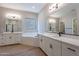 Spa-like bathroom with double vanity and a large soaking tub at 19014 W Ocotillo Rd, Waddell, AZ 85355