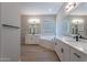 Elegant bathroom with double vanity, soaking tub, and shower at 19014 W Ocotillo Rd, Waddell, AZ 85355