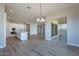 Open dining area with wood-look tile floors and access to the backyard at 19014 W Ocotillo Rd, Waddell, AZ 85355