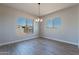 Bright dining room with hardwood floors and a chandelier at 19014 W Ocotillo Rd, Waddell, AZ 85355