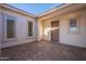 Covered entryway with tile flooring and neutral-colored walls at 19014 W Ocotillo Rd, Waddell, AZ 85355