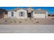 Single-story home with a two-car garage and landscaped front yard at 19014 W Ocotillo Rd, Waddell, AZ 85355