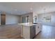Open concept kitchen with island and stainless steel appliances at 19014 W Ocotillo Rd, Waddell, AZ 85355