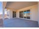 Large covered patio with sliding glass doors at 19014 W Ocotillo Rd, Waddell, AZ 85355