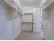 Spacious walk-in closet with ample shelving and hanging space at 19014 W Ocotillo Rd, Waddell, AZ 85355