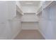 Large walk-in closet with double hanging rods and shelving at 19014 W Ocotillo Rd, Waddell, AZ 85355