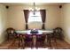 Dining room featuring an elegant chandelier, wooden table, and chairs at 10931 W Peoria Ave, Sun City, AZ 85351