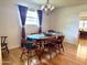 Traditional dining room with hardwood floors, chandelier, and an oval wood table at 10931 W Peoria Ave, Sun City, AZ 85351