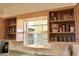 Kitchen cabinets near the sink offer storage for glassware, mugs, and other drinkware at 10931 W Peoria Ave, Sun City, AZ 85351