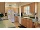 Bright kitchen featuring wood cabinets, modern appliances, and ample counter space at 10931 W Peoria Ave, Sun City, AZ 85351