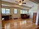 Cozy living room featuring a seating area, and hardwood floors throughout at 10931 W Peoria Ave, Sun City, AZ 85351