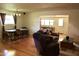 Living room with hardwood floors offers a cozy space for relaxation and entertaining at 10931 W Peoria Ave, Sun City, AZ 85351