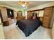 Main bedroom featuring wood furnishings, neutral carpet, and built in cabinets at 10931 W Peoria Ave, Sun City, AZ 85351