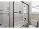 Bathroom with a shower/tub combo and white subway tile at 18223 W Rancho Ct, Litchfield Park, AZ 85340