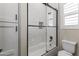 Modern bathroom with white subway tile, glass shower, and freestanding tub at 18223 W Rancho Ct, Litchfield Park, AZ 85340