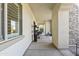 Long covered walkway leading to the home's entrance at 18223 W Rancho Ct, Litchfield Park, AZ 85340