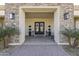 Elegant entryway with double doors and stonework at 18223 W Rancho Ct, Litchfield Park, AZ 85340